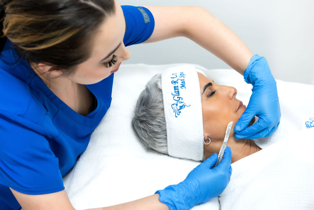 Botox specialist performing a wrinkle-reducing treatment on a client, showcasing the precision and care of the procedure.